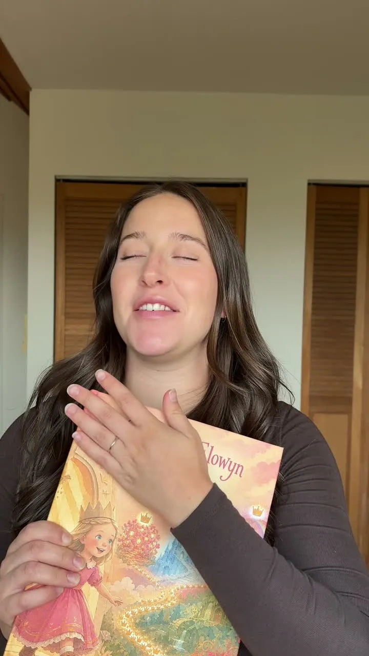 A child reacting while looking through her personalized Sundayfawn storybook