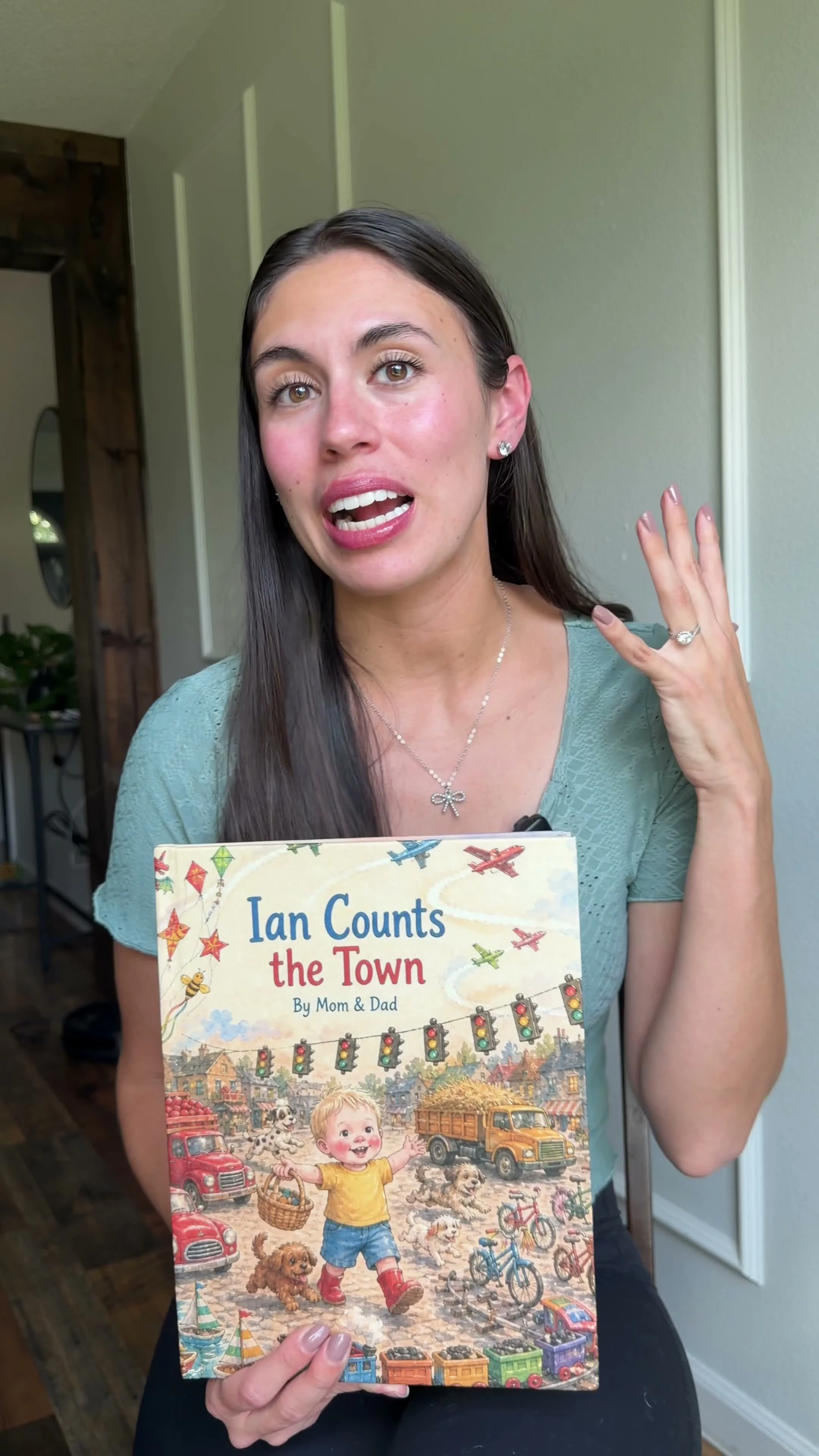 A child holding and looking through his personalized counting storybook